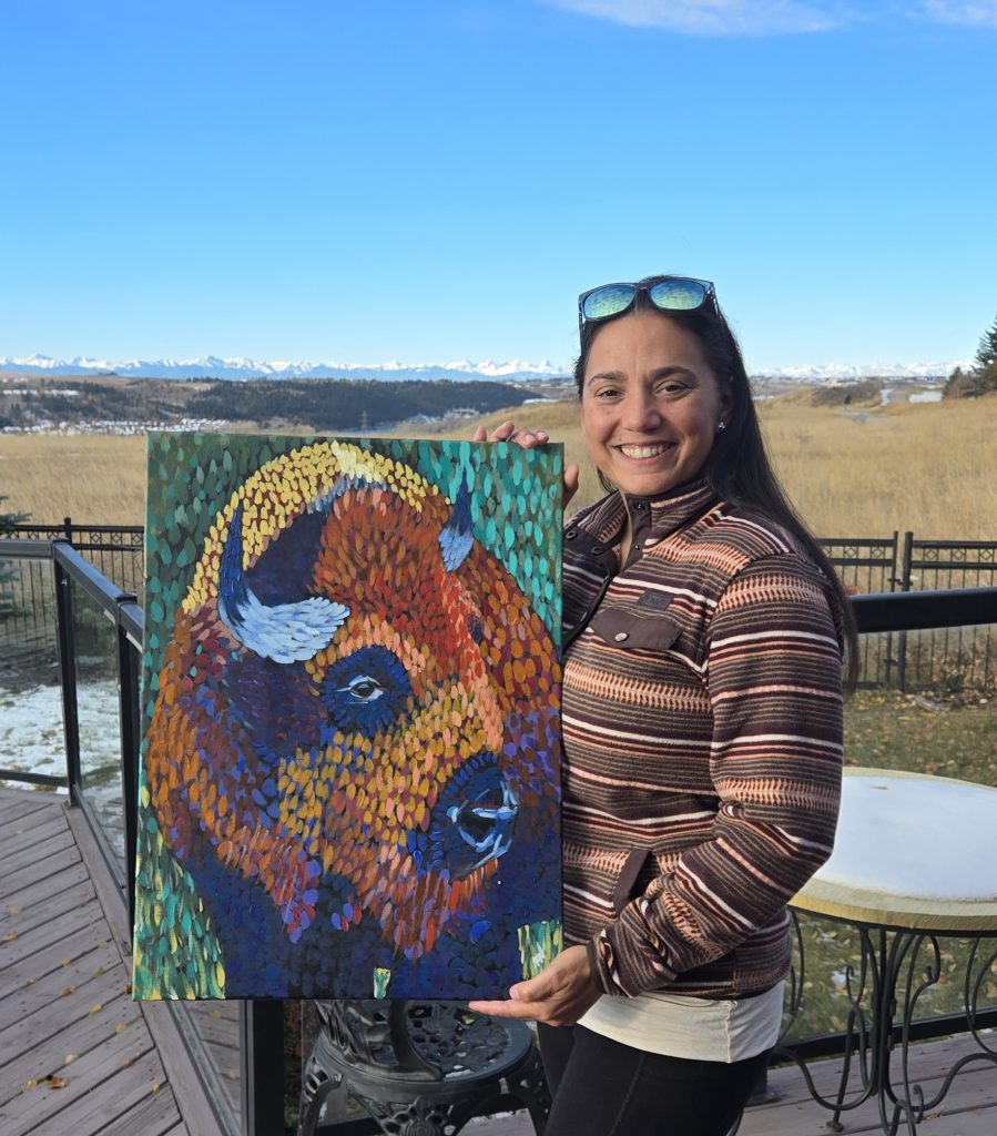 Bison with his new owner in front of the rocky mountains